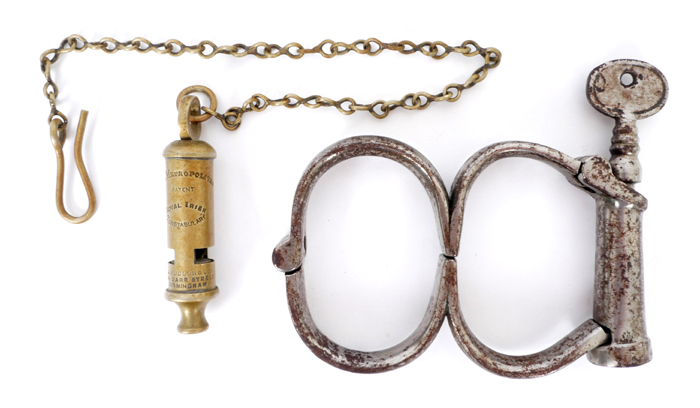 Royal Irish Constabulary, police whistle and a pair of handuffs. at Whyte's Auctions