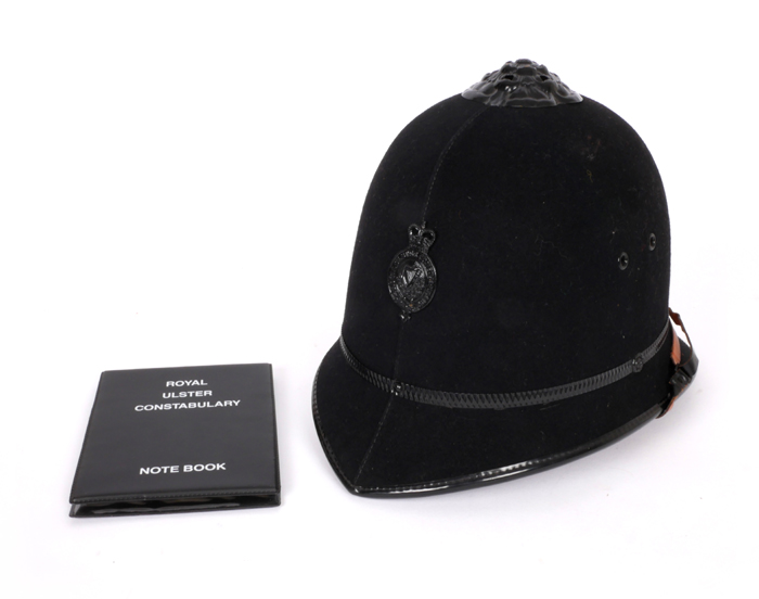 Royal Ulster Constabulary, helmet and notebook. at Whyte's Auctions