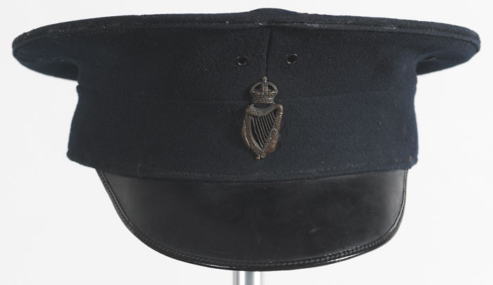 1902-1922: Royal Irish Constabulary peak cap and badge at Whyte's Auctions