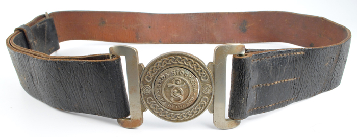 circa 1940s: Early Garda Sochna belt and police helmet at Whyte's Auctions