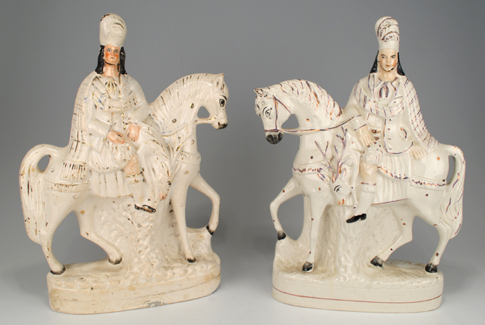 circa 1880: Pair of Staffordshire figures on horseback in ceremonial dress at Whyte's Auctions