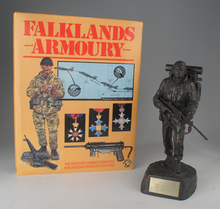 1982: Falklands War Royal Marines presentation figure, Argentinean helmet and book at Whyte's Auctions