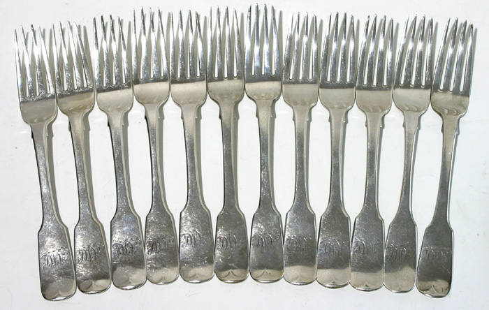 A matched set of twelve early 19th century Irish silver fiddle-pattern table forks. at Whyte's Auctions