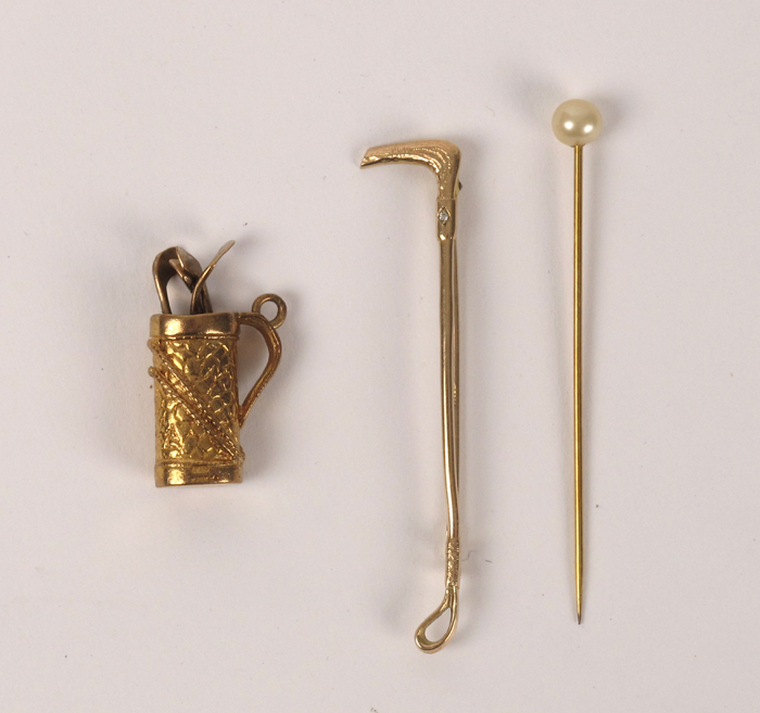 Gold golf bag and stock pin at Whyte's Auctions