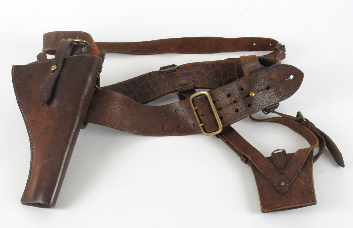 A brown leather Sam Browne belt, holster and pouch at Whyte's Auctions