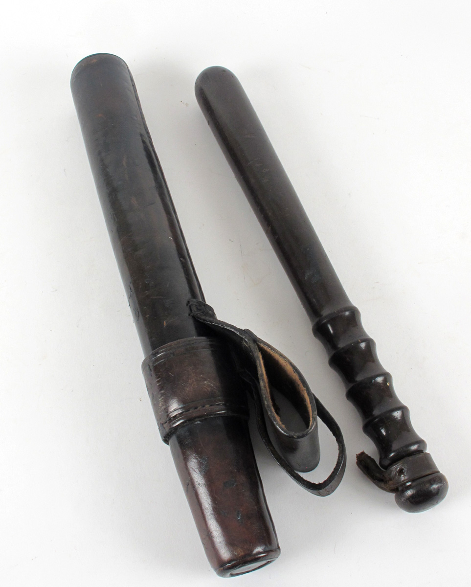 Police truncheon in leather scabbard at Whyte's Auctions