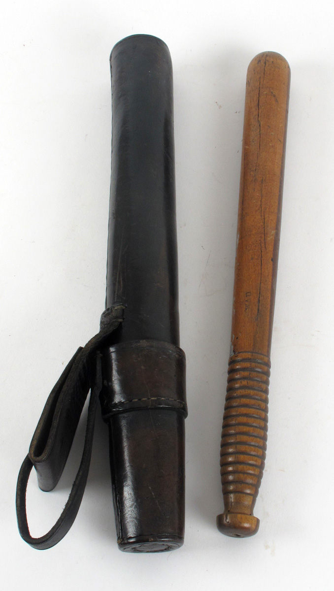 Garda truncheon in leather scabbard at Whyte's Auctions