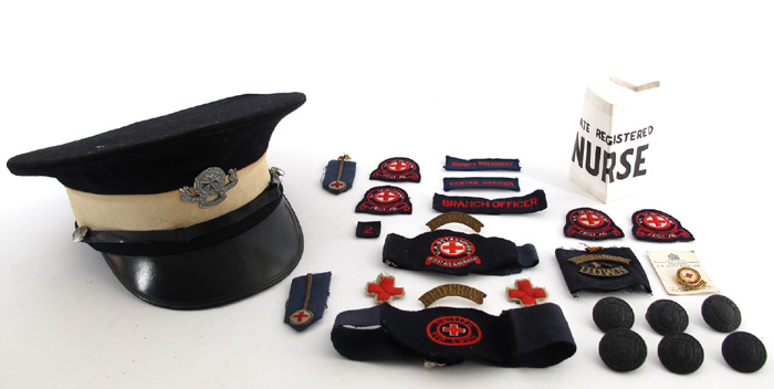Red Cross uniform and badges and a St. John's Ambulance cap. at Whyte's Auctions