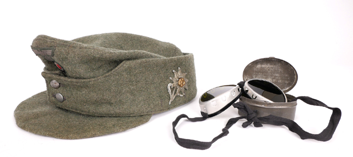 1939-1945 German Third Reich, Gebirgsjager M43 field cap and ski goggles. at Whyte's Auctions