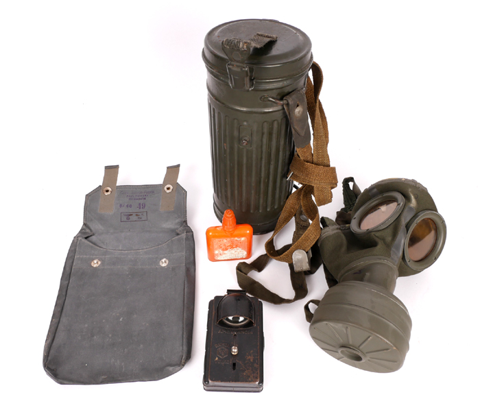 1939-1945 German Third Reich, Heer issue gas-mask, gas-cape bag with decontamination fluid bottle and ambulancia flashlight. at Whyte's Auctions