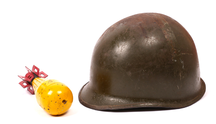 1942-1945 United States of America, WWII Army helmet and a practice mortar round. at Whyte's Auctions