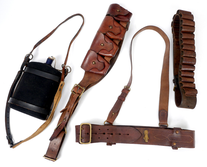 1913-1922 A Sam Browne belt, two bandoliers and a water canteen. at Whyte's Auctions