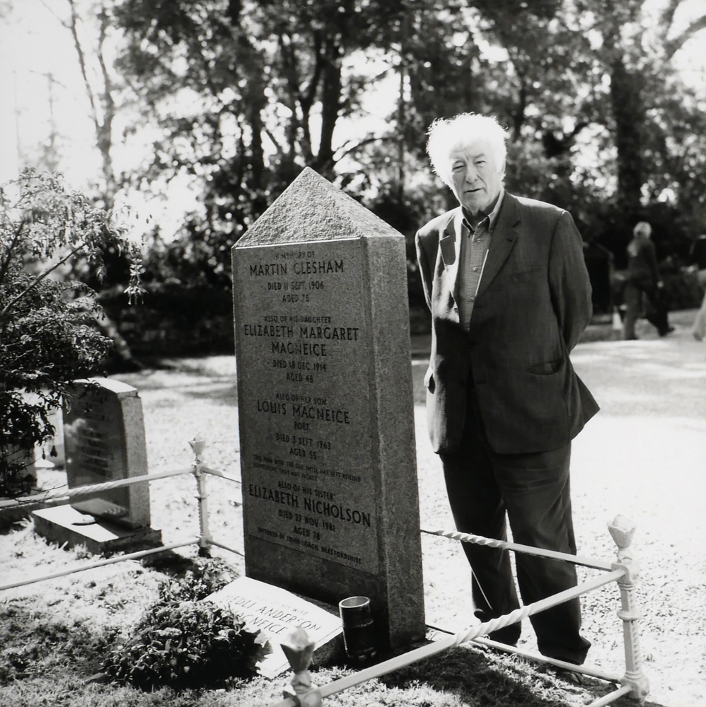 SEAMUS HEANEY AT THE GRAVESTONE OF LOUIS MACNEICE by John Minihan (b.1946) (b.1946) at Whyte's Auctions