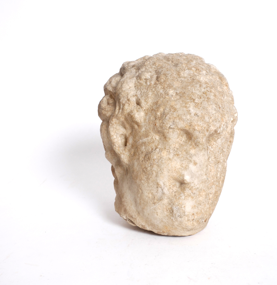 Carved stone head. at Whyte's Auctions