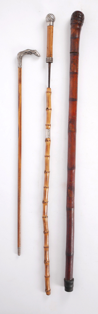 Edwardian swagger stick and two sword-sticks. at Whyte's Auctions