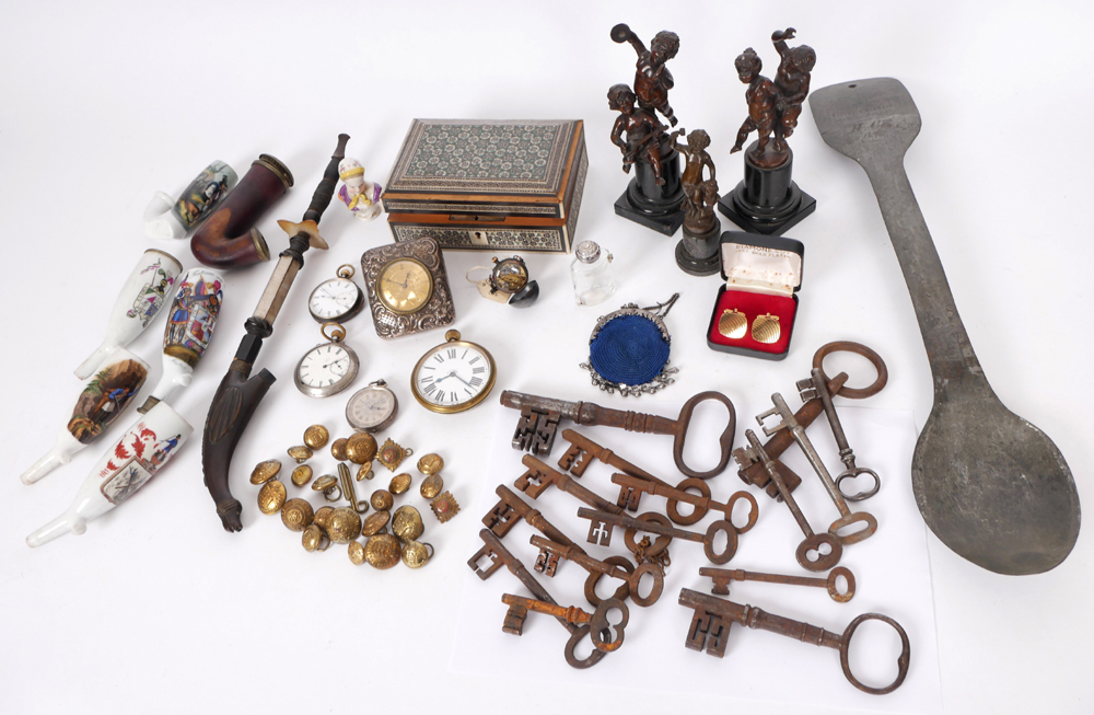 Miscellaneous lot of porcelain pipes, novelty sport trophy, iron door keys, military buttons. at Whyte's Auctions