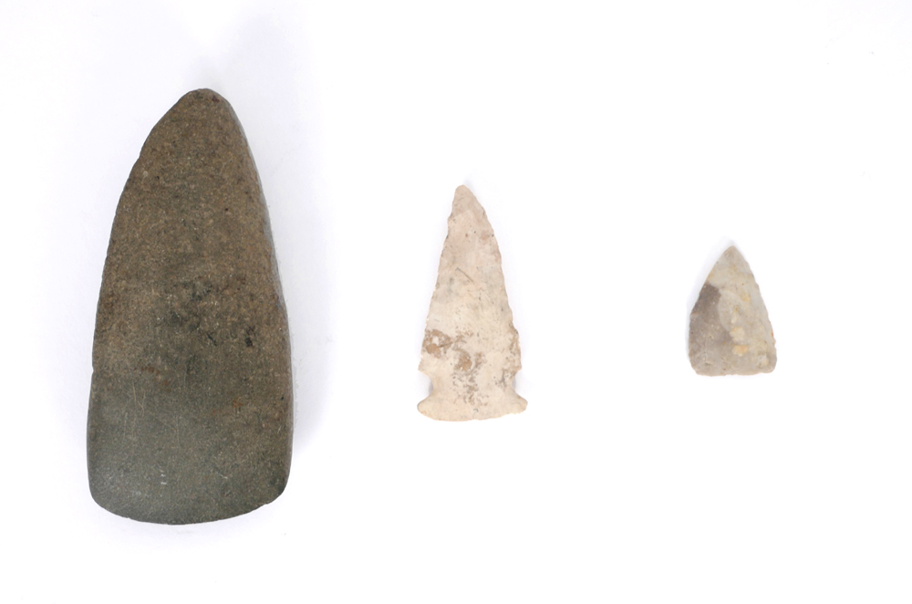 8th century AD polished stone axe head and two Clovis arrow heads. at Whyte's Auctions