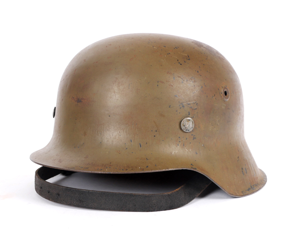 20th century steel helmet modelled on the German M35 helmet. at Whyte's Auctions