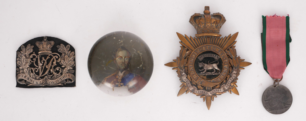 Victorian military badges and paperweight. at Whyte's Auctions
