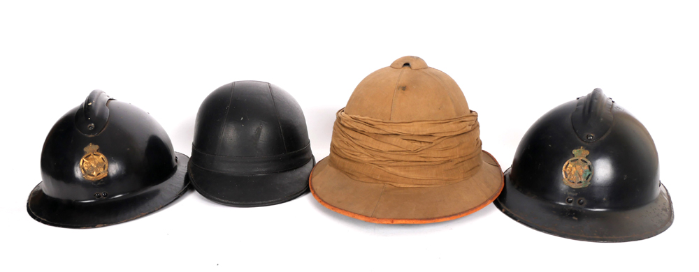 A collection of mid-20th century military and civil helmets. at Whyte's Auctions