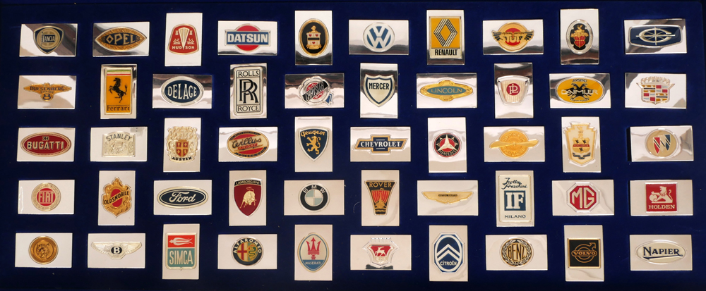 'Official Emblems of The World's Greatest Automobiles' - collection of silver and enamel ingots. at Whyte's Auctions
