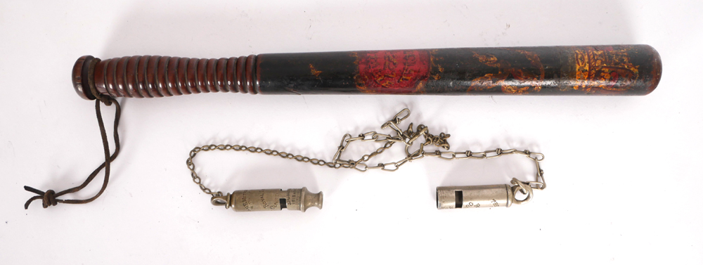 A Victorian decorated police truncheon and two Royal Irish Constabulary whistles. at Whyte's Auctions
