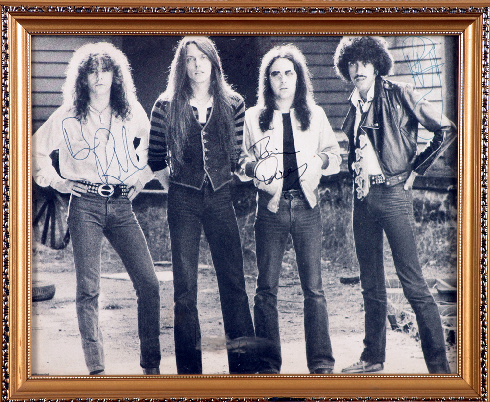 Thin Lizzy, photograph signed by all four band-members. at Whyte's Auctions