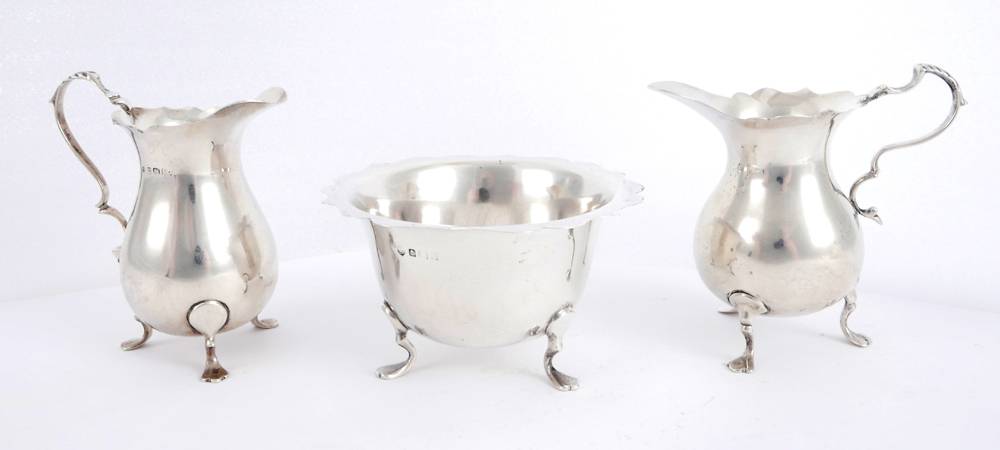Silver cream jugs and sugar bowl at Whyte's Auctions