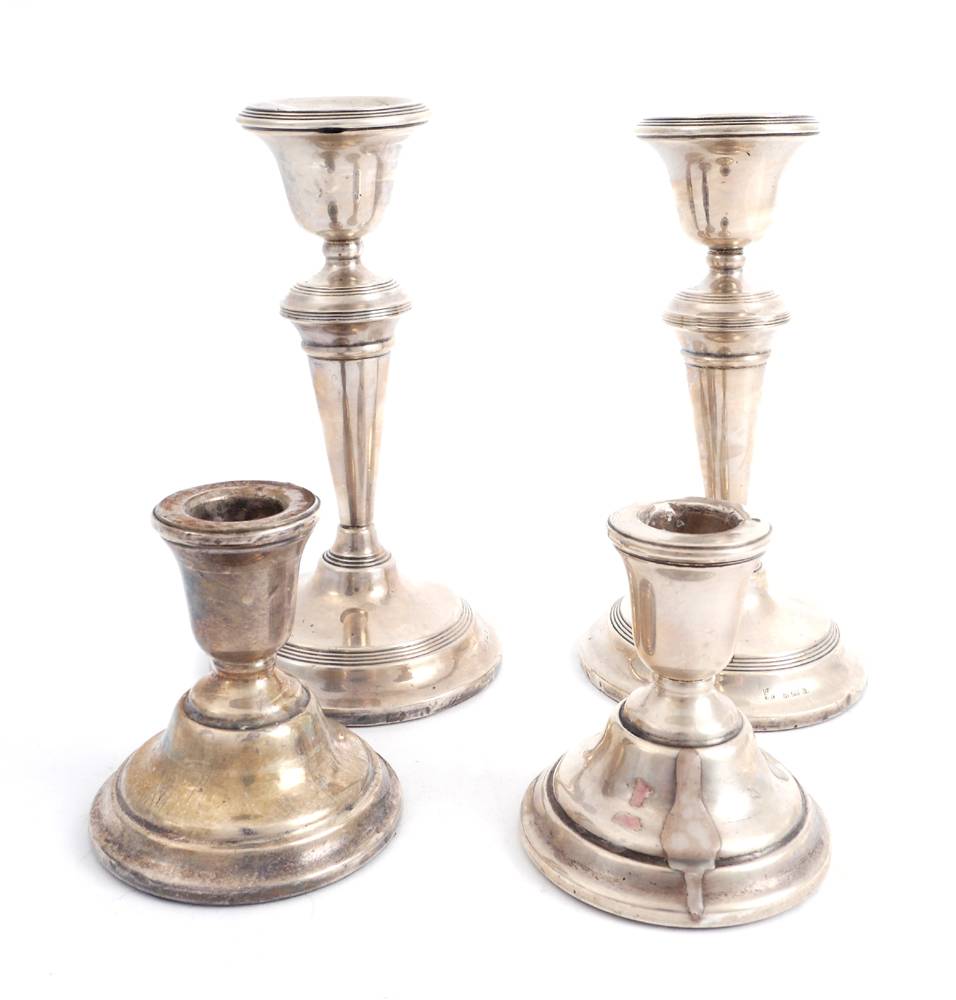 Pair of George V silver candlesticks and a pair of silver desk candlesticks. at Whyte's Auctions