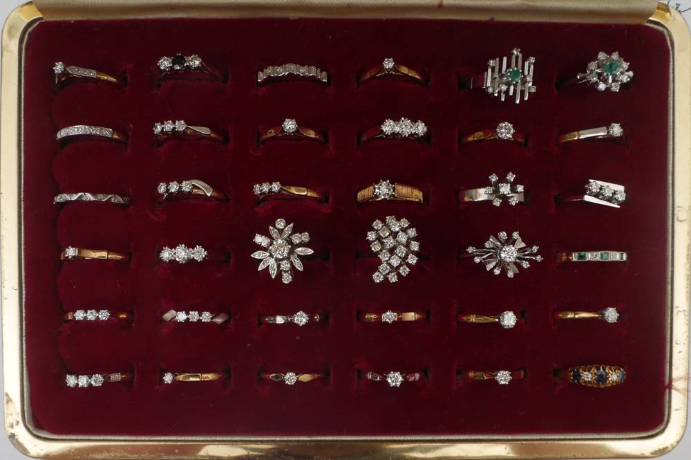36 diamond-mounted gold rings. at Whyte's Auctions