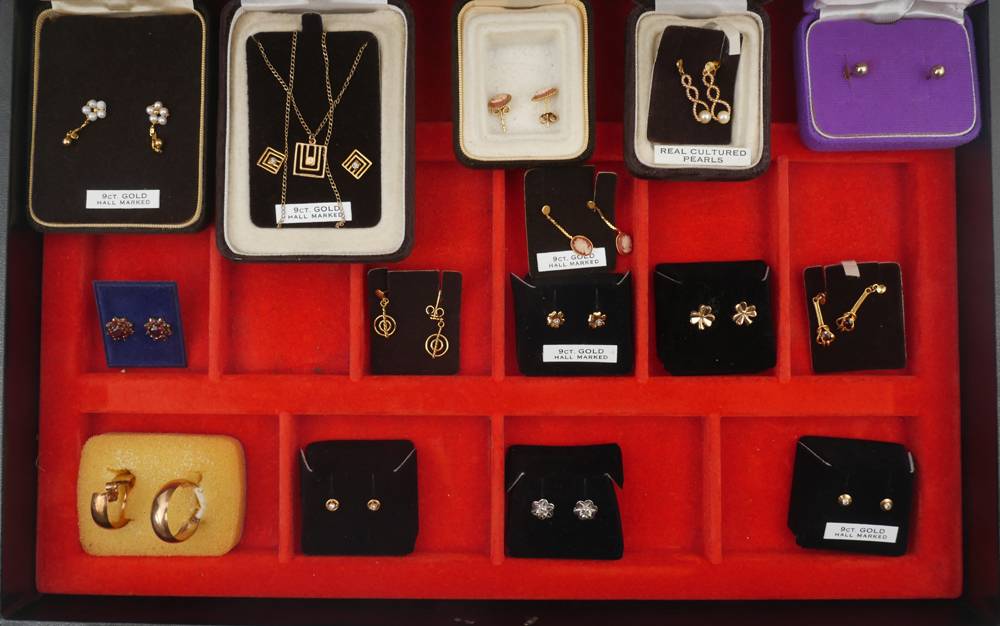15 pairs of gold earrings. at Whyte's Auctions