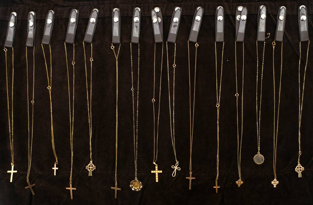 15 gold crosses, medals and chains. at Whyte's Auctions