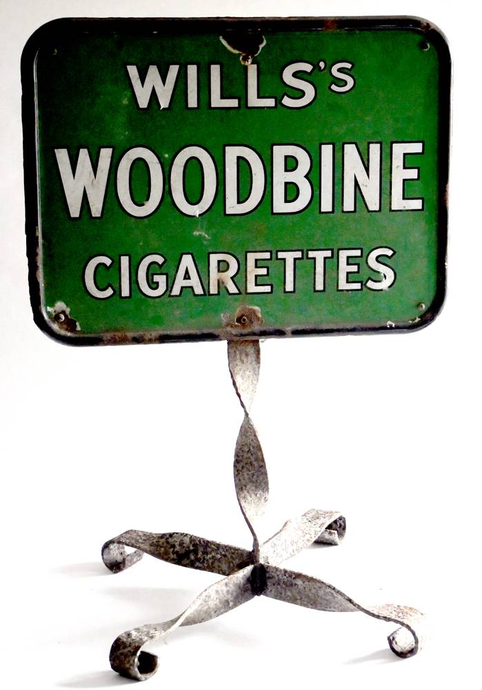 A Wills's Gold Flake / Woodbine metal advertising sign, on wrought iron stand. at Whyte's Auctions