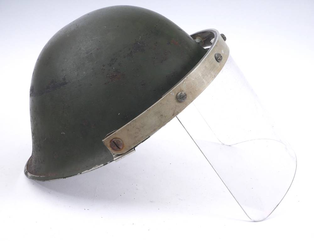 Circa 1970 Northern Ireland, British Army steel helmet with visor. at Whyte's Auctions