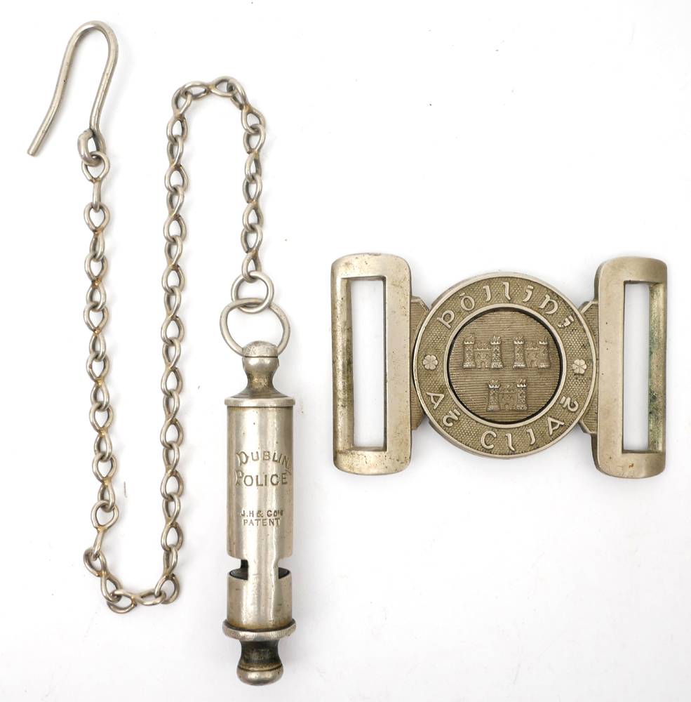 1922-1925 Poilin th Cliath brass belt buckle and 'Dublin Police' whistle. at Whyte's Auctions