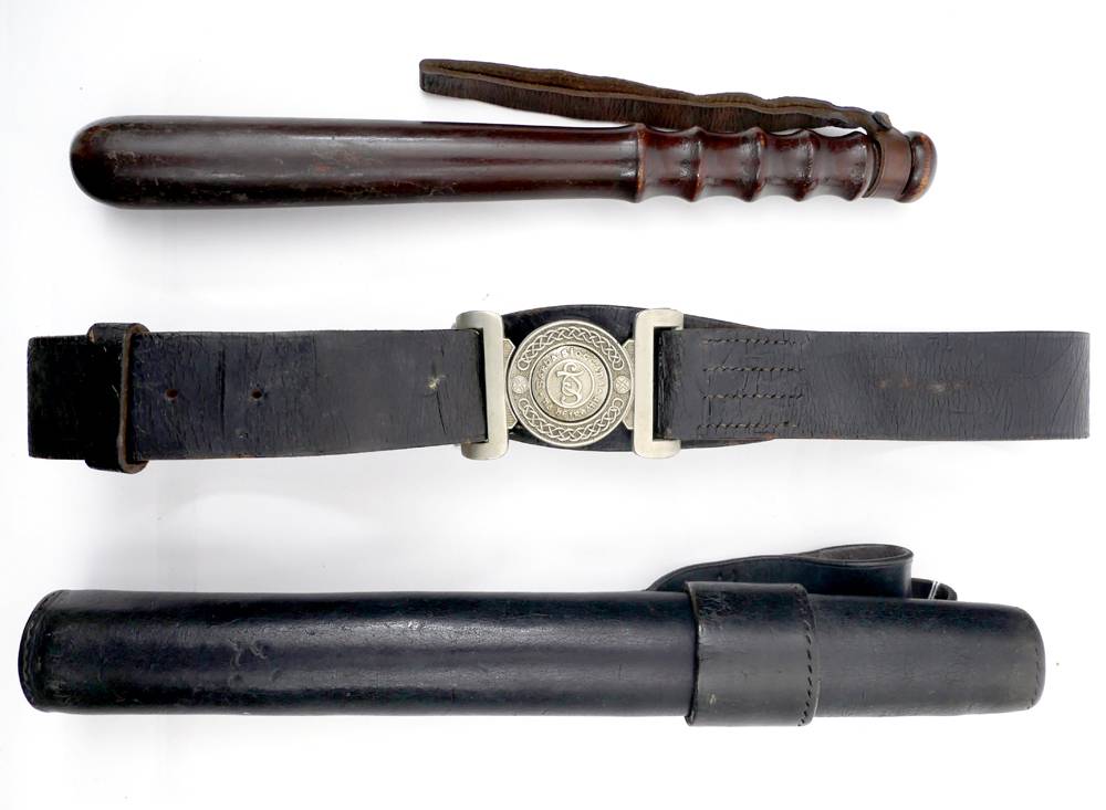1920s Garda Sothchna uniform belt and truncheon with uniform scabbard. at Whyte's Auctions