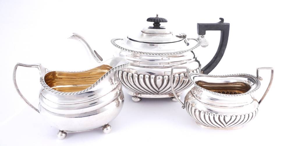 A three-piece silver harlequin tea service.<br> at Whyte's Auctions