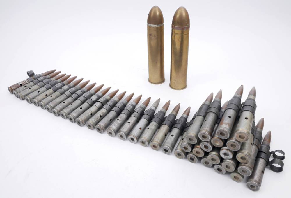 Belt of 39 inert .50 calibre cartridges and two inert QF 2-pounder 'pom-pom' rounds. at Whyte's Auctions