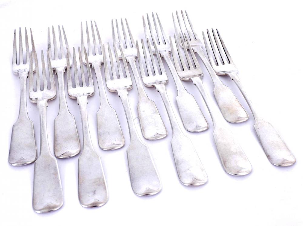 A set of twelve George III Irish silver fiddle pattern dessert forks by John England. at Whyte's Auctions