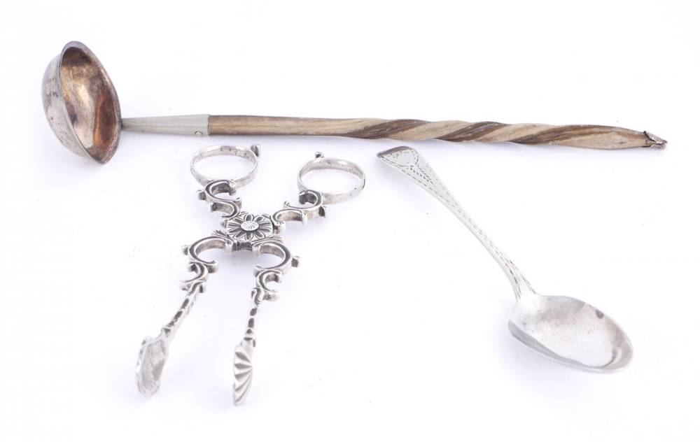 George II Irish silver sugar nips, George III Irish silver toddy ladle and a Cork silver teaspoon. at Whyte's Auctions