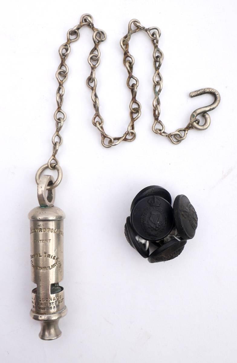 Royal Irish Constabulary whistle and set of six tunic buttons. at Whyte's Auctions
