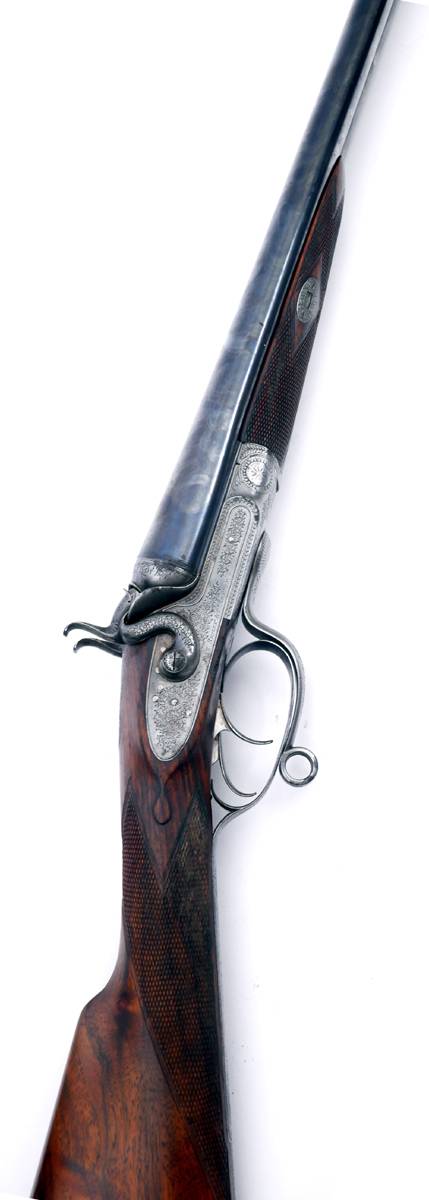 E J Churchill 12 bore, double-barelled, side-by-side, hammer-action shotgun for E M Reilly and Co. at Whyte's Auctions