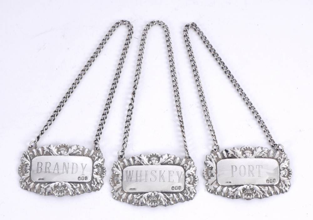 Set of three Irish silver decanter labels. at Whyte's Auctions