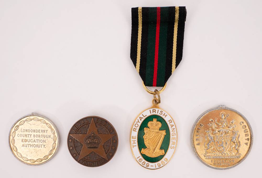 Circa 1914 Loyal Dublin Volunteers lapel badge and 3 medals. (4) at Whyte's Auctions