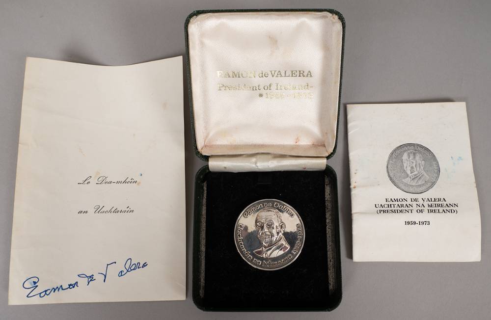 Eamon de Valera. 1973 silver medal and signed Presidential compliment slip. at Whyte's Auctions