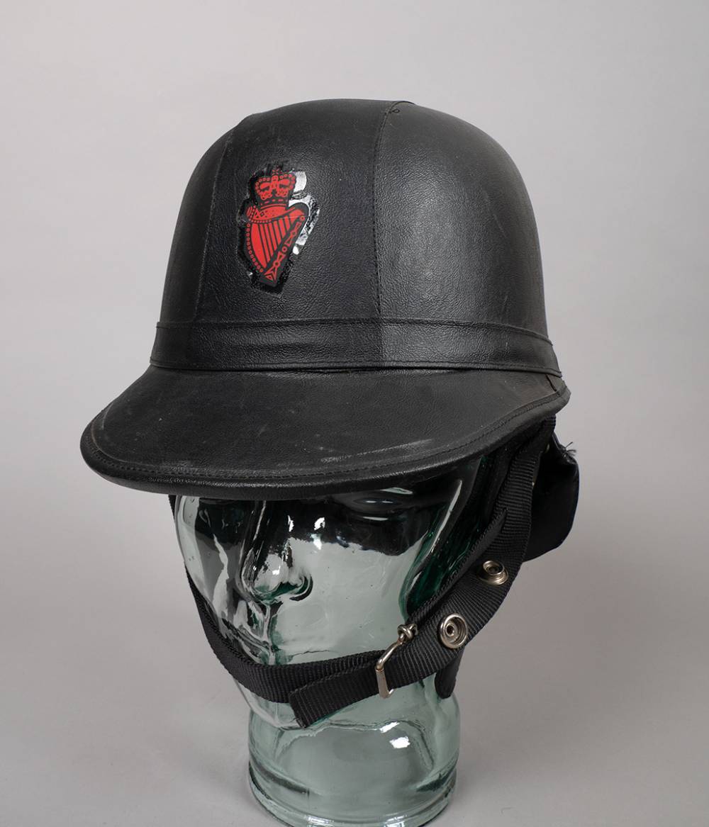 1975 Royal Ulster Constabulary public order Skulgarde cork helmet. at Whyte's Auctions