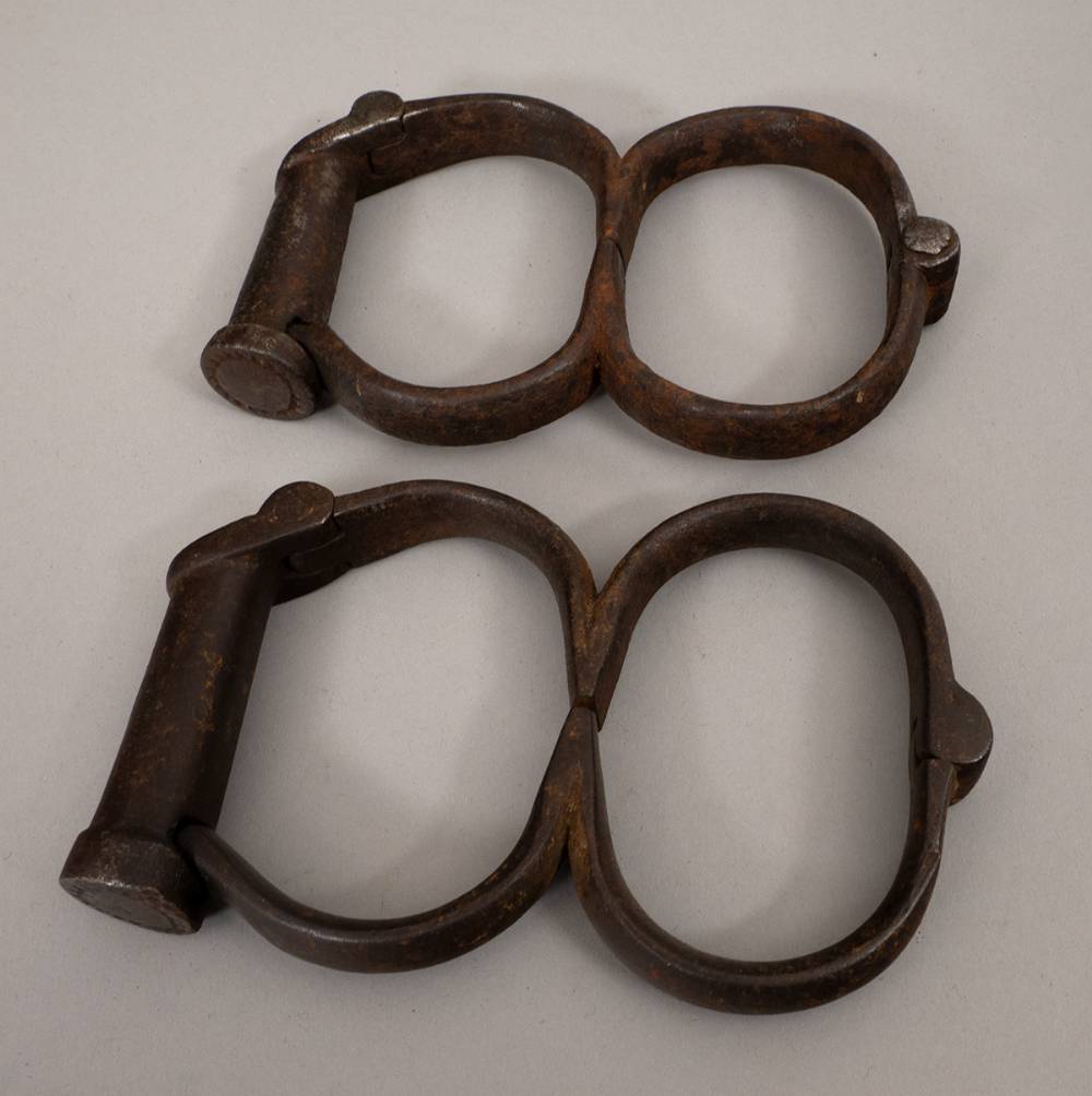 19th century figure of 8 screw lock handcuffs by Hiatt, thought to be Royal Irish Constabulary issue. at Whyte's Auctions
