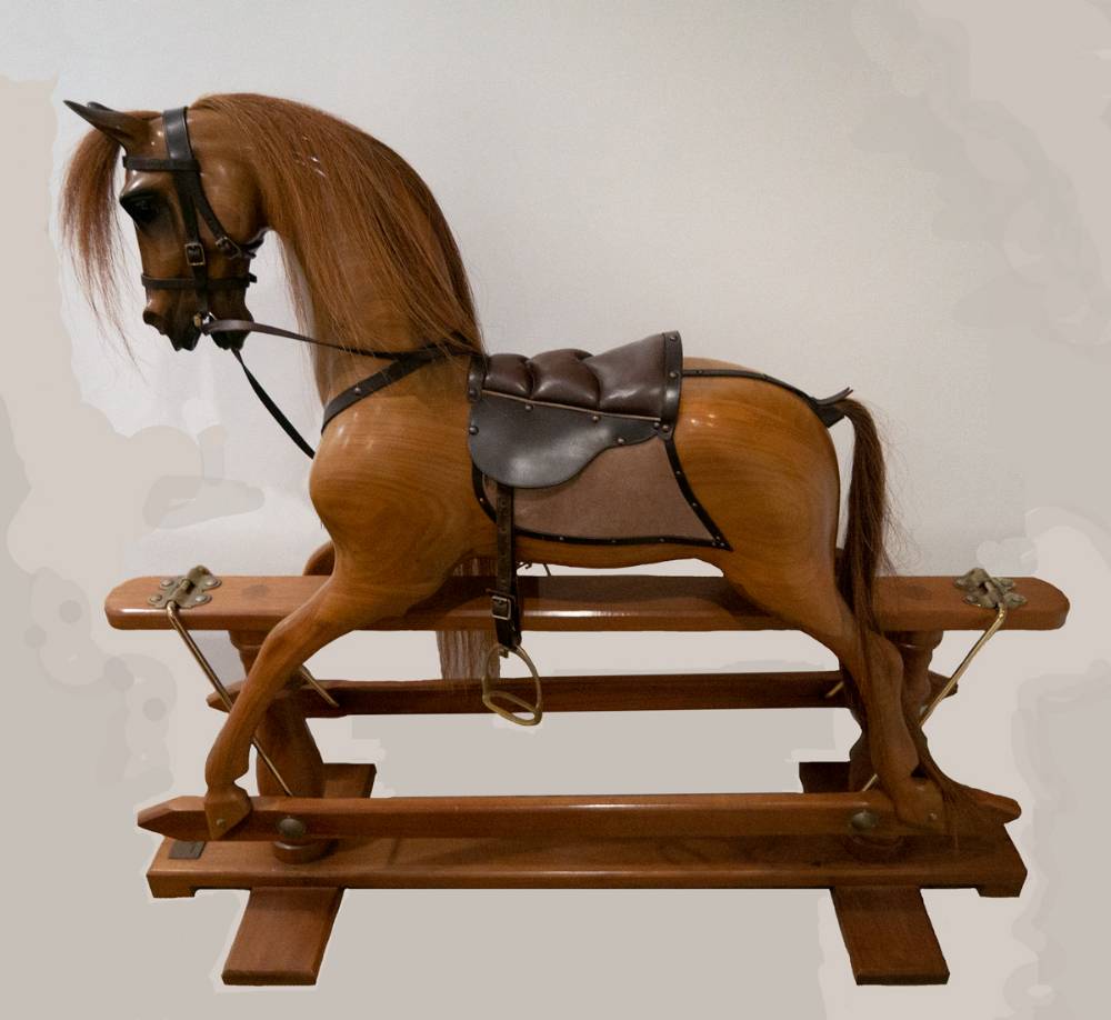 A natural wood trestle rocking horse handcrafted by Stevenson Brothers, England. at Whyte's Auctions