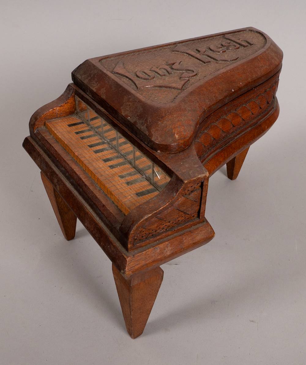 1980s Long Kesh prisoner art: a hand carved box in the shape of a piano. at Whyte's Auctions