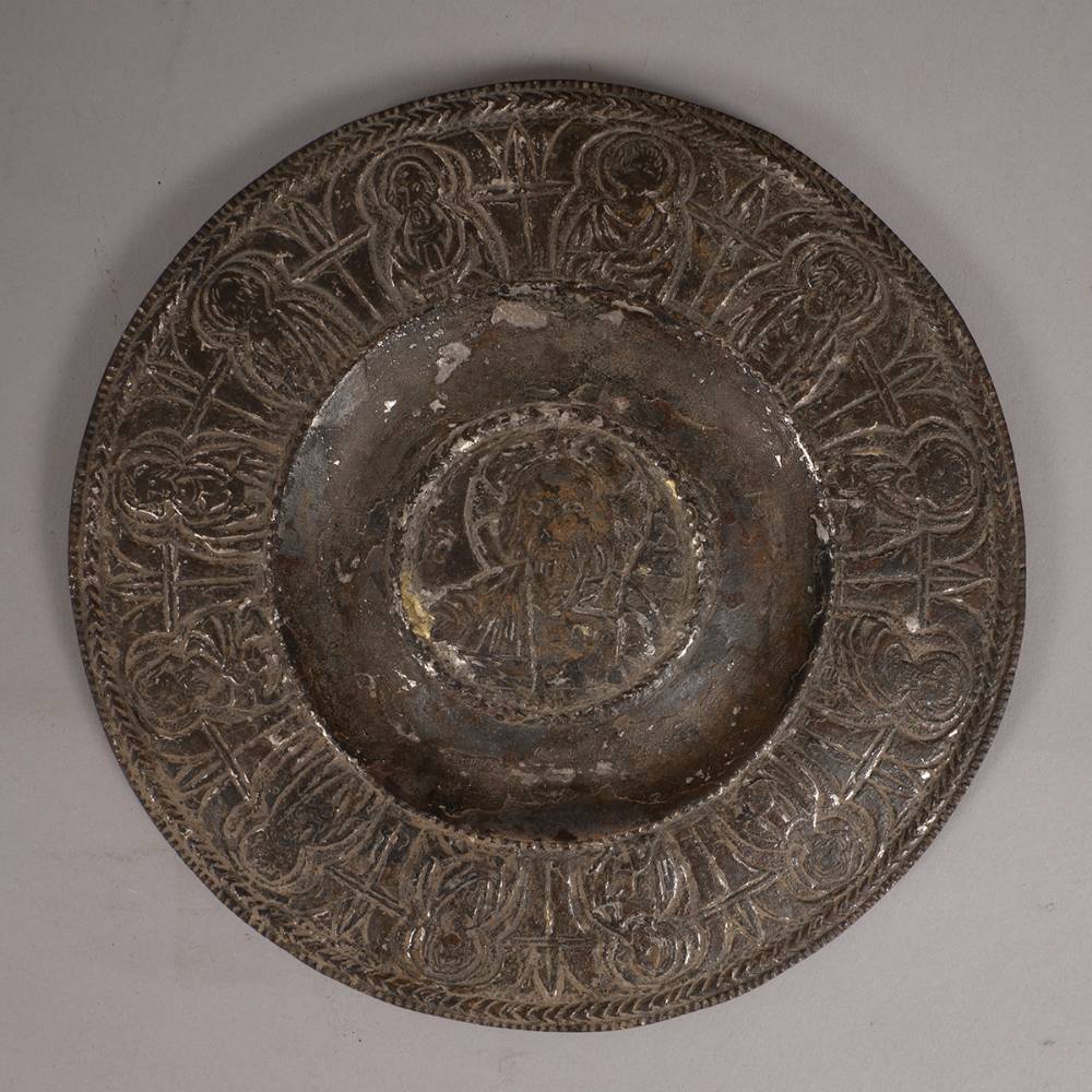 12th/13th Century. A bronze paten showing Christ and the Twelve Apostles. at Whyte's Auctions